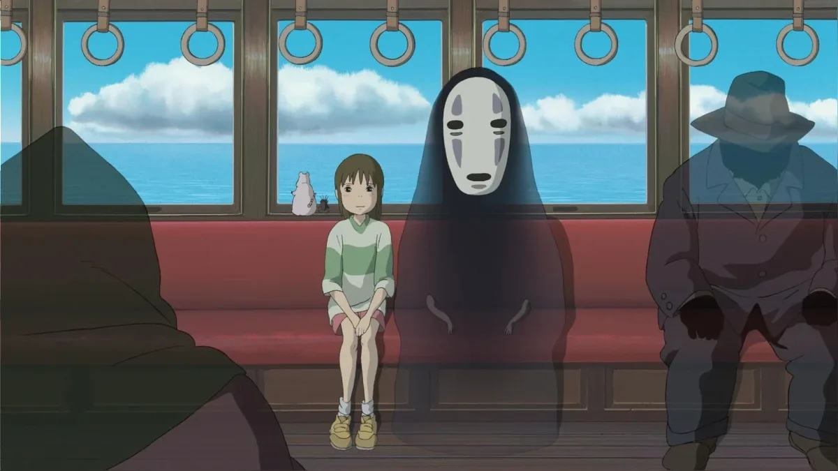 Chihiro y Sin Cara en el tren fantasma del anime "El viaje de Chihiro" de Studio Ghibli