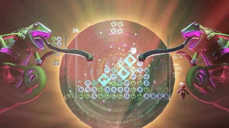 Lumines Arises: gameplay con camaleones neón, tablero de puzle y marcador 1.292 puntos en un escenario psicodélico.
