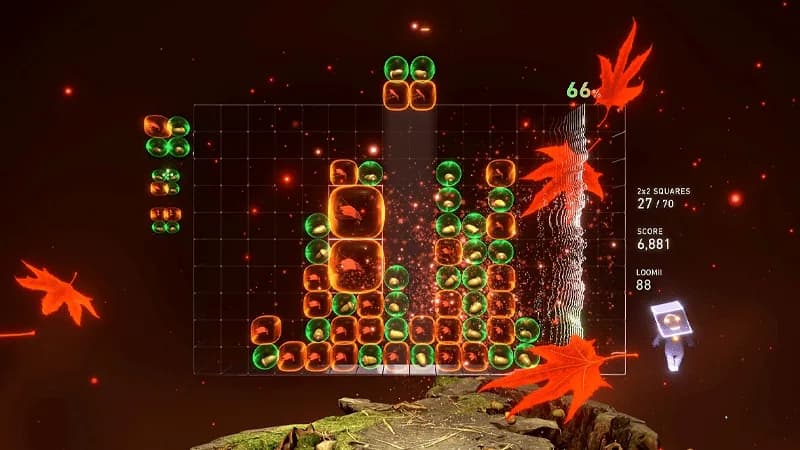 Lumines Remastered: gameplay con bloques naranjas y verdes, puntuación 6.881, hojas otoñales y fondo oscuro rojizo.