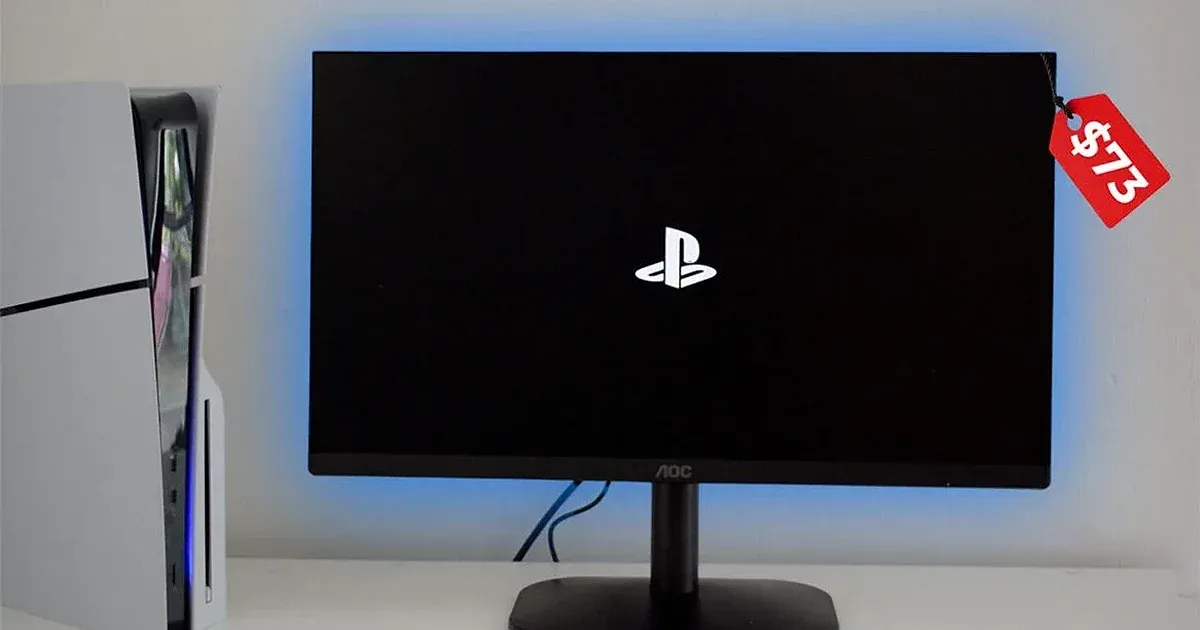 Monitor AOC de 73$ conectado a PS5 mostrando logo de PlayStation en pantalla negra con retroiluminación azul.